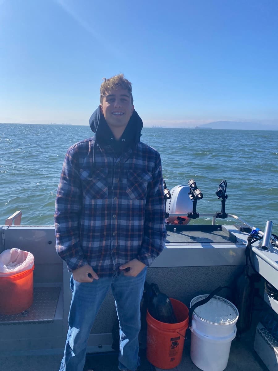 Daniel fishing on a boat off Fort Myers, Florida